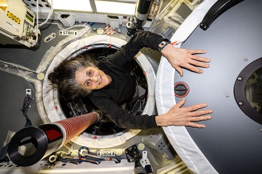 Astronaut Suni Williams between the SpaceX Dragon and the Harmony module