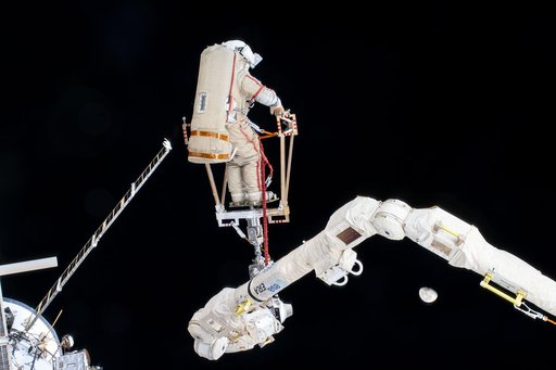 Roscosmos cosmonaut Alexey Ovchinin rides the European robotic arm