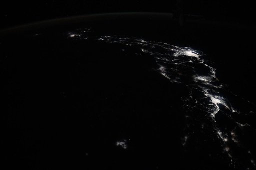The city lights of Osaka, Nagoya, and Tokyo on the island nation of Japan
