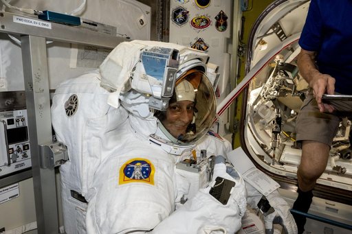 Astronaut Suni Williams tries on and evaluates her spacesuit