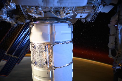 The Cygnus space freighter berthed to the Earth-facing port on the Unity module