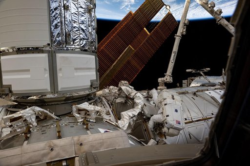 Astronaut Butch Wilmore works outside the International Space Station