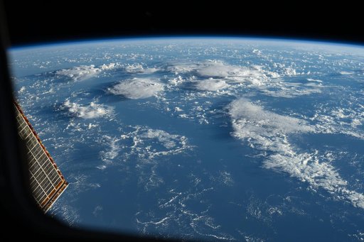Storm clouds rise above the South Pacific Ocean northwest of New Zealand