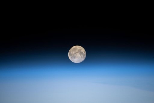 The full Moon above Earth's horizon