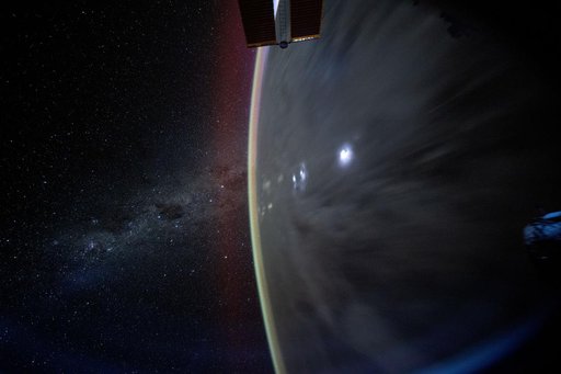 The Milky Way appears beyond Earth's horizon
