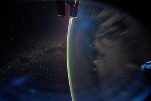 The Milky Way appears beyond Earth's horizon