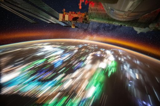 The city lights of Southeast Asia underneath Earth's atmospheric glow