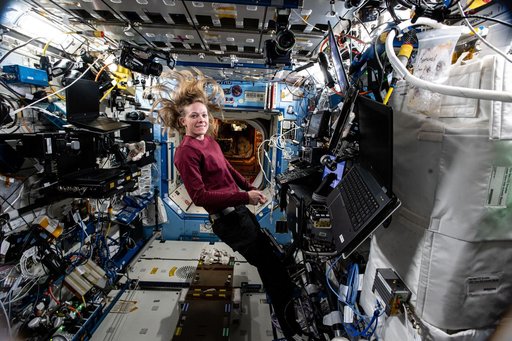 Astronaut Nichole Ayers is pictured at the controls of the robotics workstation