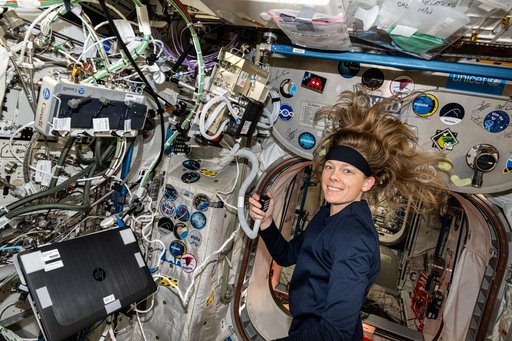 Astronaut Nichole Ayers talks on a ham radio with students from Arkansas