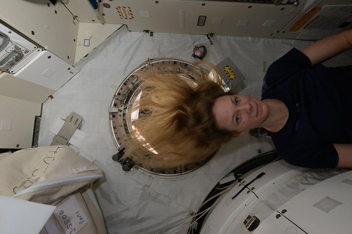 Astronaut Nichole Ayers poses for a portrait inside the Kibo laboratory module