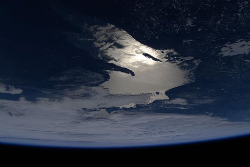Oblique of view of the sun's glint beaming off Lake Superior
