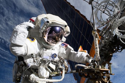 Astronaut Anne McClain is pictured near one of the International Space Station's main solar arrays