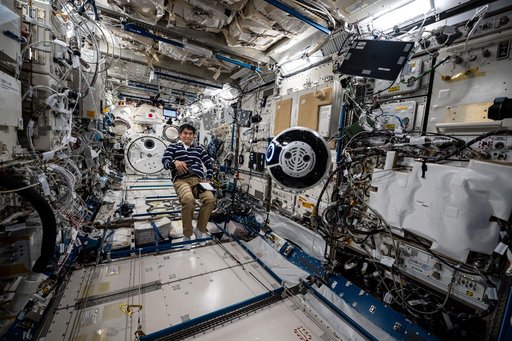 JAXA astronaut Takuya Onishi monitors the Japanese Experiment Module Internal Ball Camera 2