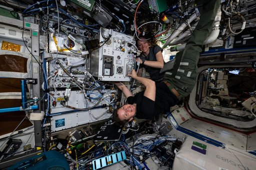 Expedition 73 Flight Engineers Nichole Ayers and Anne McClain pose for a portrait during maintenance activities