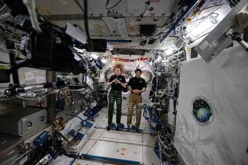 Astronauts Nichole Ayers and Takuya Onishi talk to students from New York
