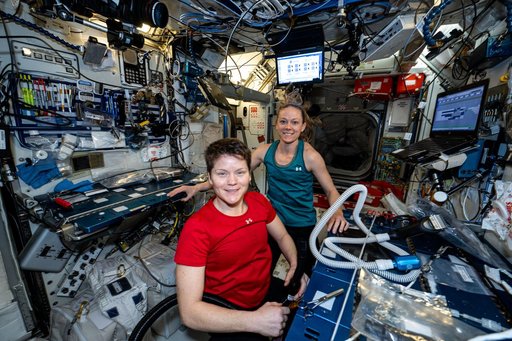 NASA astronauts Anne McClain and Nichole Ayers pose for a portrait together