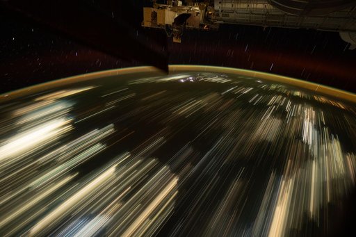 The city lights of Southeast Asia streak below the International Space Station