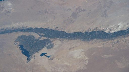 The leaf-shaped Faiyum Oasis fed by a channel of the River Nile
