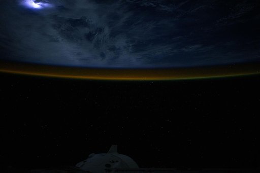 Lightning illuminates the clouds above the Atlantic Ocean