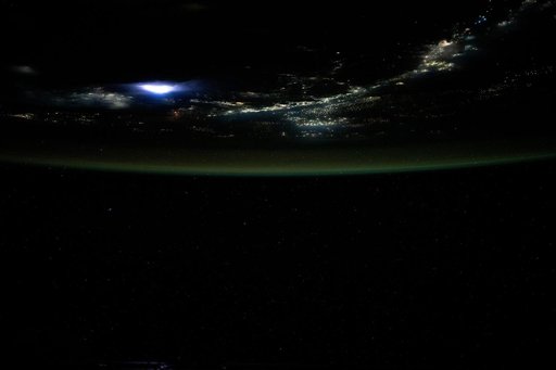 Lightning illuminates the clouds above Southeast Asia
