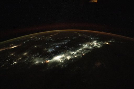 Jakarta, Indonesia, and fishing boats illuminated on the Java Sea