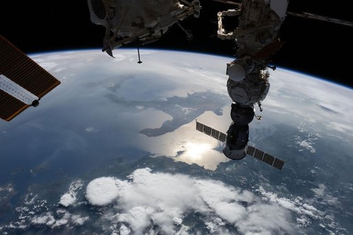 The sun's glint beams off the Adriatic Sea contrasting with the "boot" of Italy