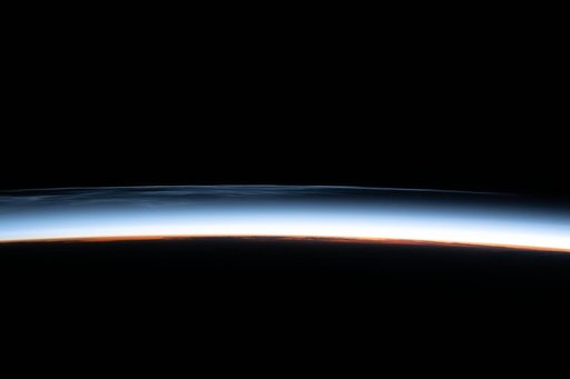 Noctilucent clouds are pictured above the North Pacific Ocean
