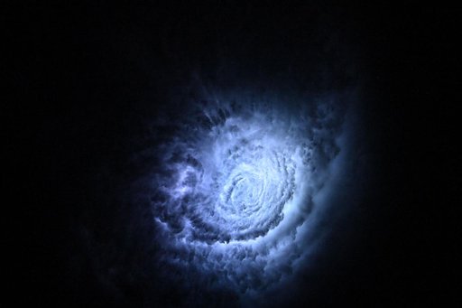 Lightning illuminates the cloud tops of Tropical Storm Erick