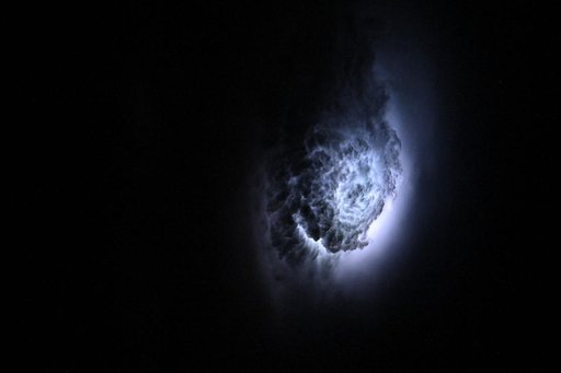Lightning illuminates the cloud tops of Tropical Storm Erick
