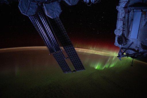 A wispy aurora spikes across the Indian Ocean