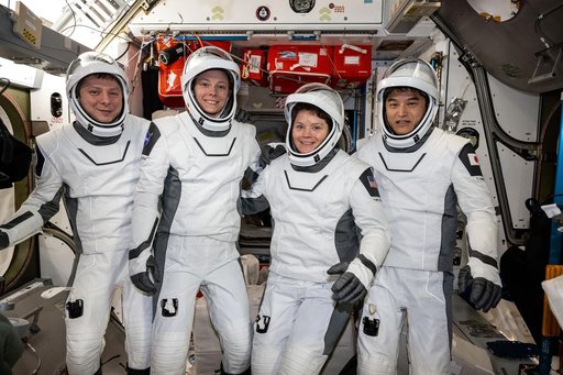 NASA's SpaceX Crew-10 member pose in their Dragon pressure suits
