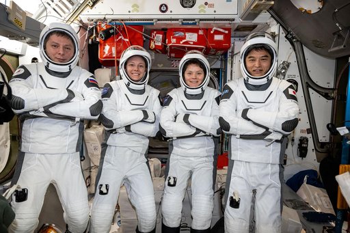 NASA's SpaceX Crew-10 member pose in their Dragon pressure suits