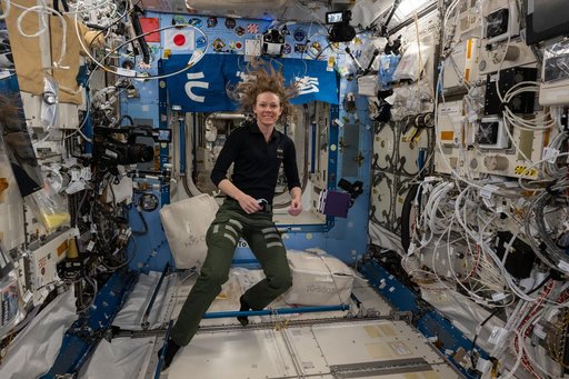 NASA astronaut Nichole Ayers smiles for a portrait during scientific operations