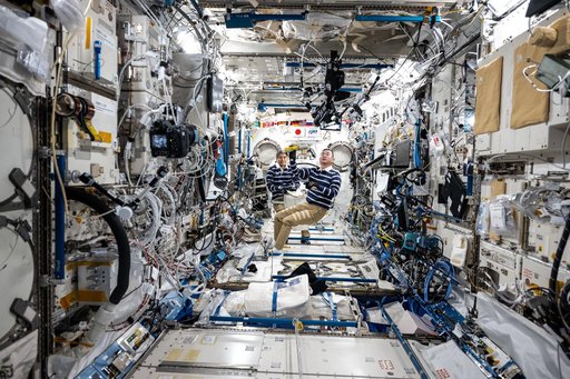 JAXA astronauts Takuya Onishi and Kimiya Yui inside the Kibo laboratory module