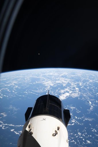 The SpaceX Dragon crew spacecraft and the Waxing Gibbous Moon