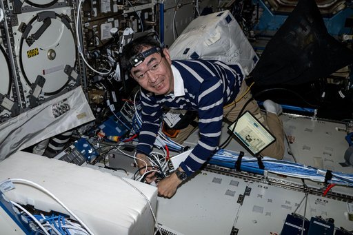 JAXA Astronaut Kimiya Yui unpacks science, supplies, and hardware