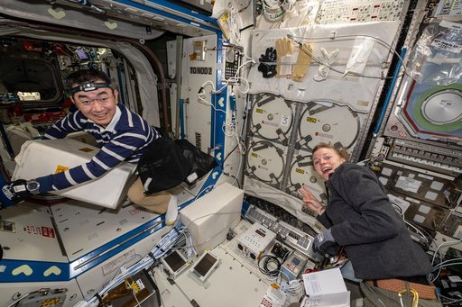 Astronauts Kimiya Yui and Zena Cardman unpack science, supplies, and hardware