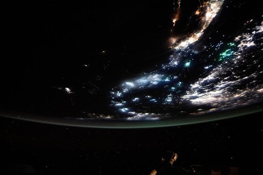 The blue-green lights of fishing boats dot the East China Sea and the Taiwan Strait
