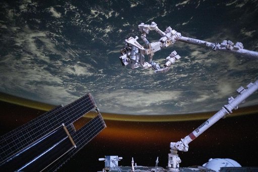 The Canadarm2 robotic arm with Dextre above the Indian Ocean