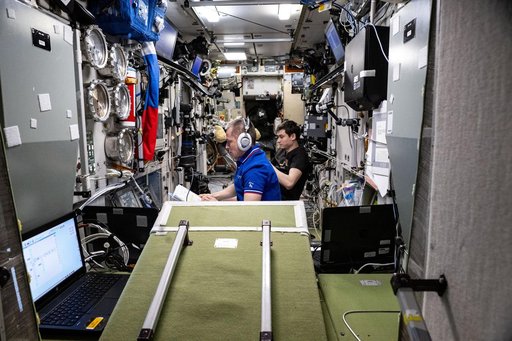 Cosmonauts Sergey Ryzhikov and Alexey Zubritsky monitor the arrival of the Progress 93 cargo craft