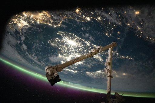 The English Channel separates the sparkling nighttime coasts of France and England