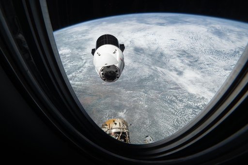 A SpaceX Dragon cargo spacecraft approaches the International Space Station