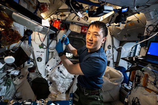 NASA astronaut Jonny Kim shows off Voyager DNA Decryption experiment hardware