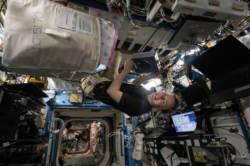 NASA astronaut Zena Cardman conducting research operations for a biotechnology experiment