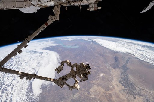 The Canadarm2 robotic arm, with Dextre—its fine-tuned robotic hand