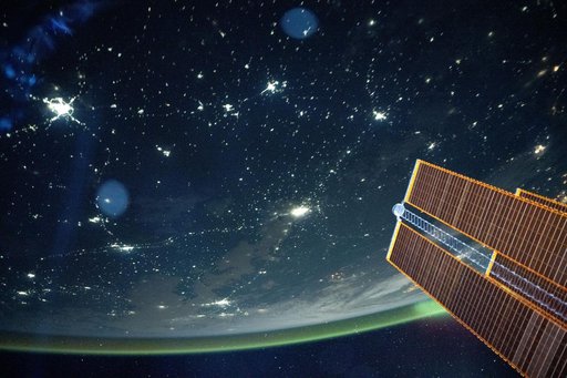 A tranquil, blue-green airglow blankets Earth's horizon above  Kazakhstan