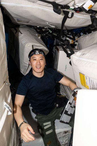 NASA astronaut Jonny Kim works on maintenance and cargo activities