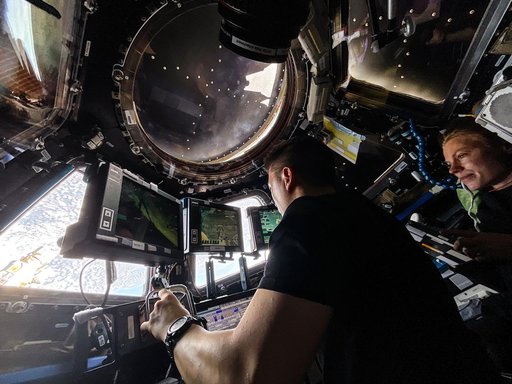 NASA astronauts Jonny Kim and Zena Cardman practice Canadarm2 robotic maneuvers at the robotics workstation