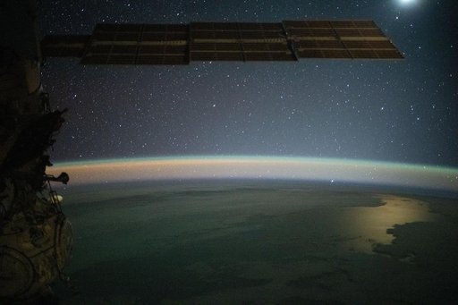 Serene image of the Moon glinting off the Southern Pacific Ocean