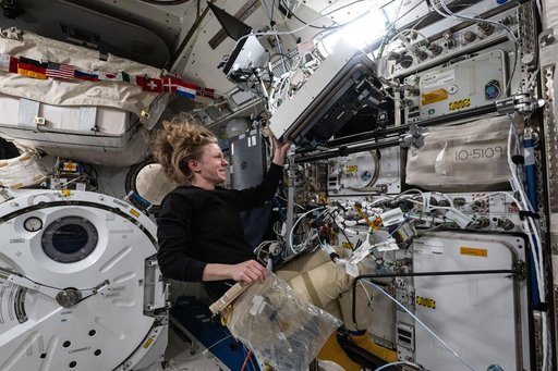 NASA astronaut Zena Cardman works inside the Kibo laboratory module